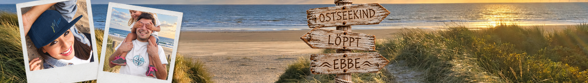 Strand mit Wegweiser